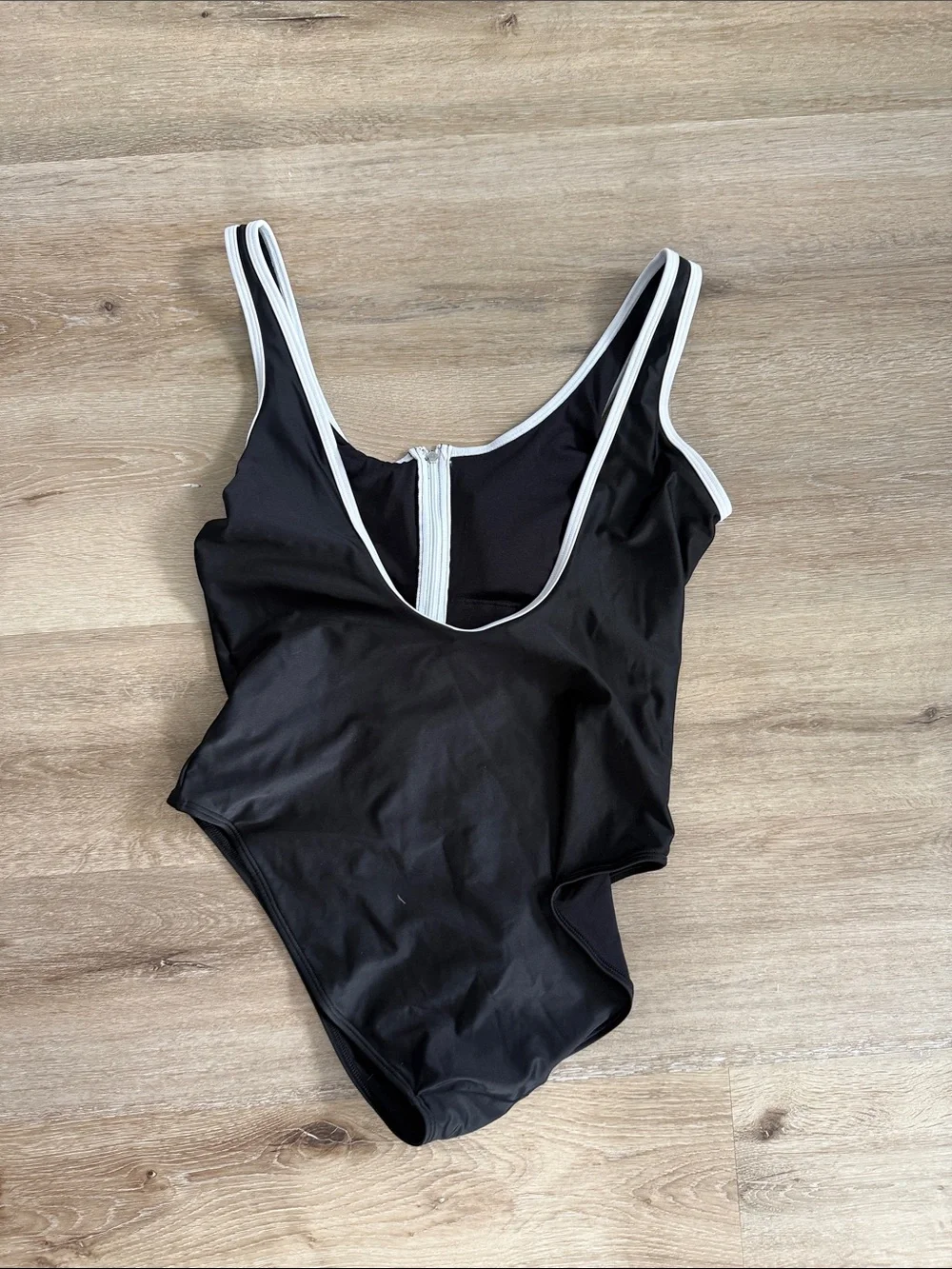Black One-Piece Swim Suit with White Trim and zipper detail